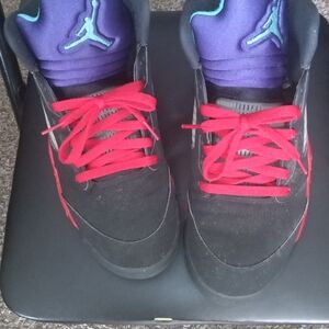 The product is a pair of Jordan 5 Retro Top 3 Black